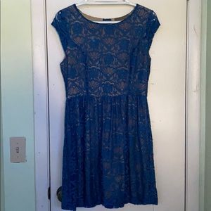 Blue dress with a pattern.